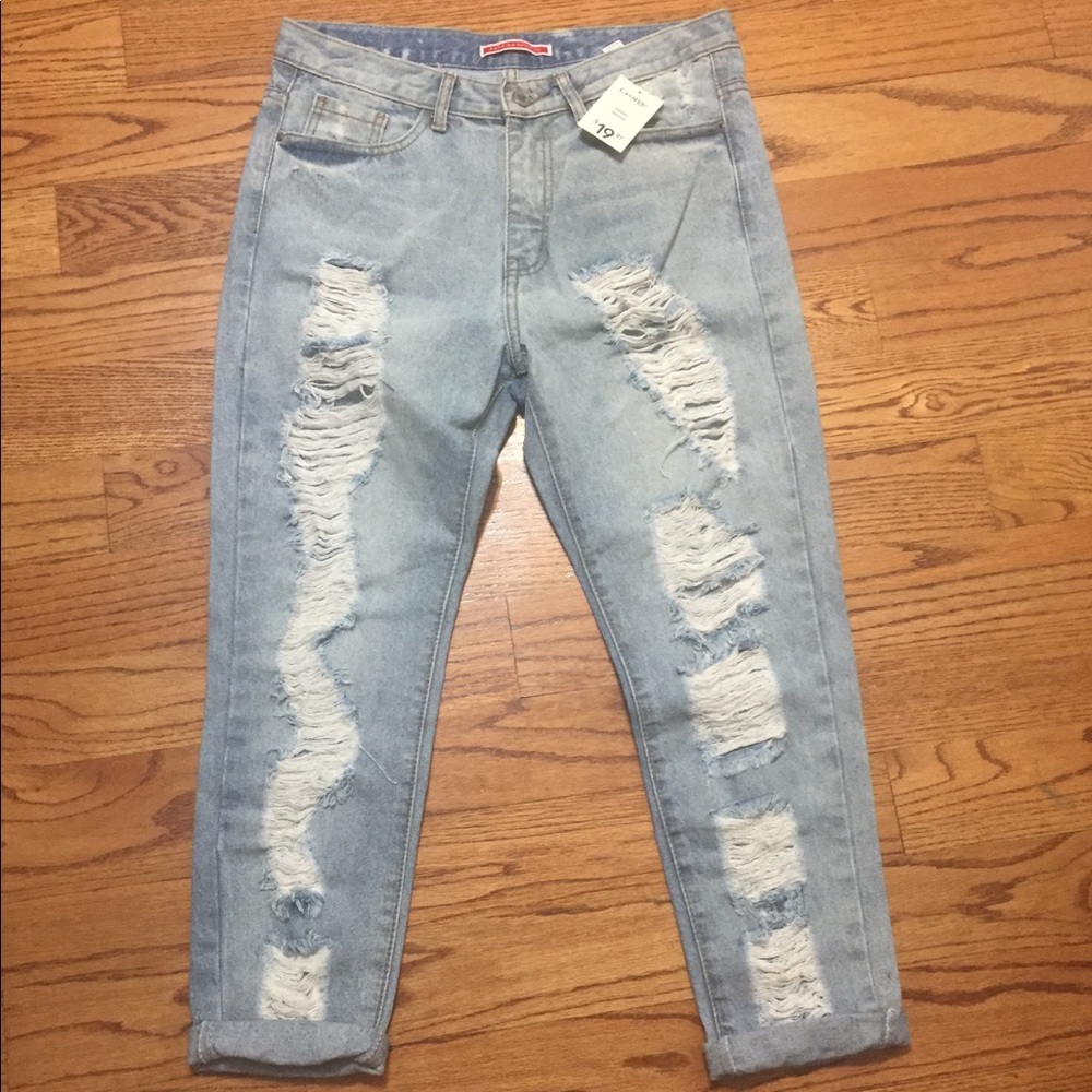Blue denim jeans with rips by Paprika, brand new